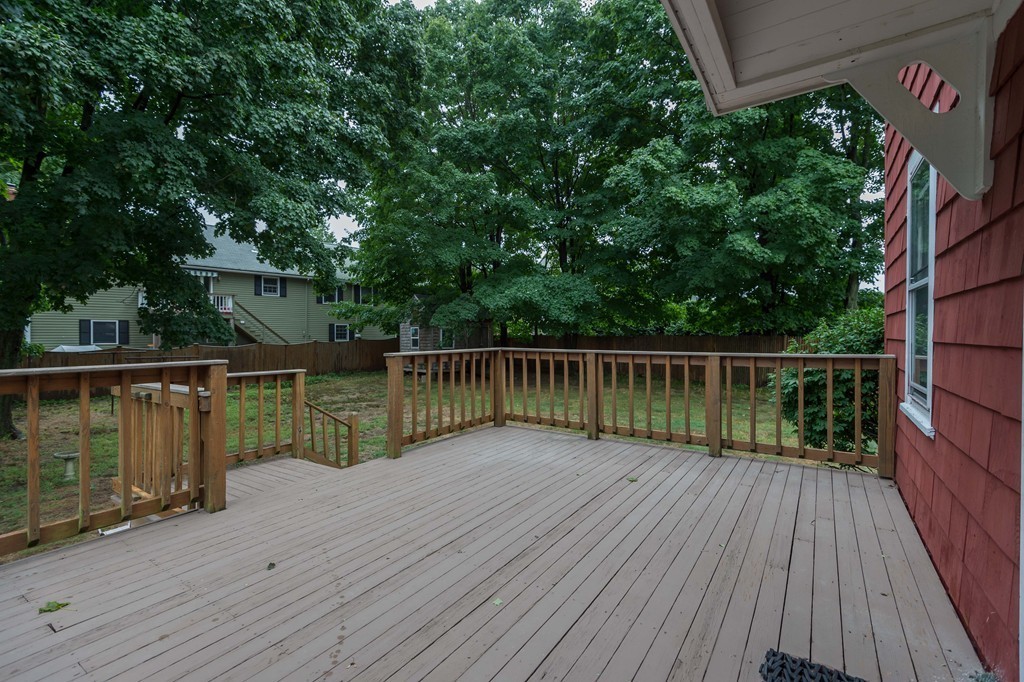 8 Spring Lane Stoneham, MA 02180 - Photo 16 of 21 a view of balcony with wooden floor and fence