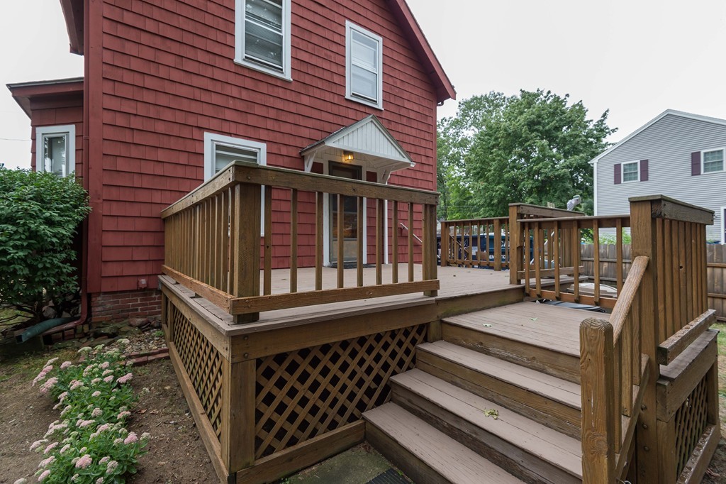 8 Spring Lane Stoneham, MA 02180 - Photo 19 of 21 a view of a house with wooden deck