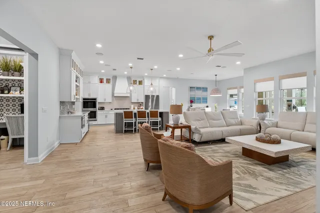 a bathroom with a granite countertop sink a toilet and a mirror