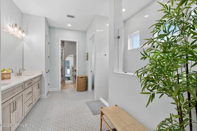 a view of hallway with chandelier