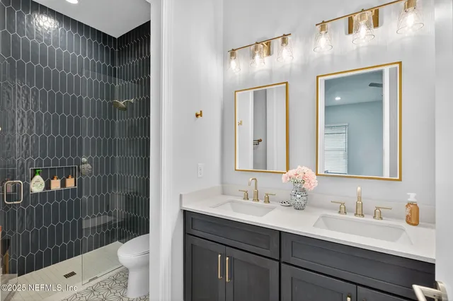 a kitchen with stainless steel appliances white cabinets and a stove top oven