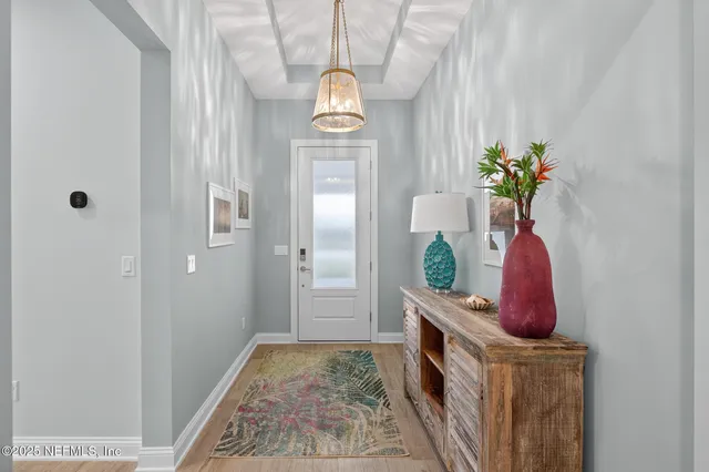 a kitchen with white cabinets and counter space
