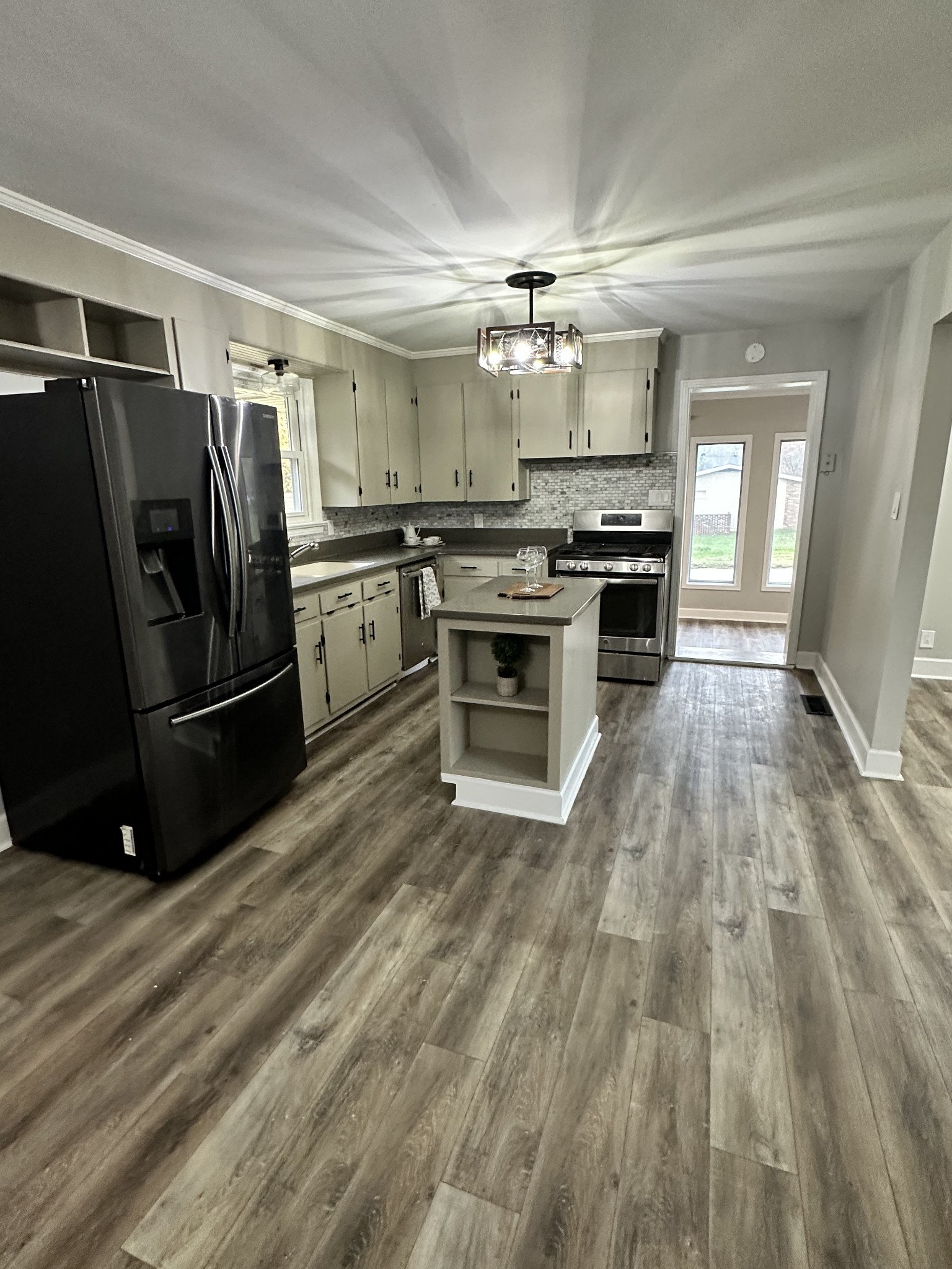 205 Excell Road Clarksville, TN 37043 - Photo 12 of 33 a kitchen with granite countertop a refrigerator oven a sink and dishwasher