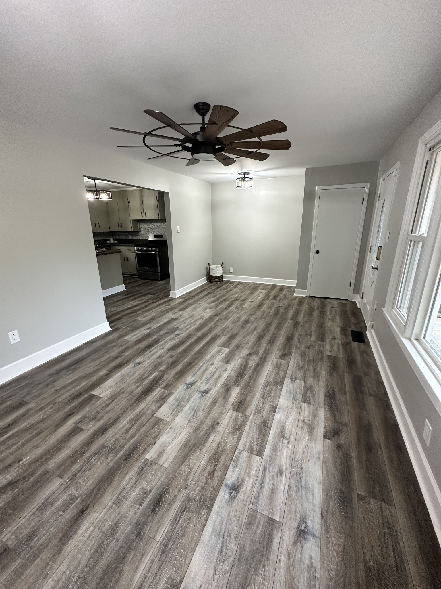 205 Excell Road Clarksville, TN 37043 - Photo 13 of 33 wooden floor in an empty room with a window