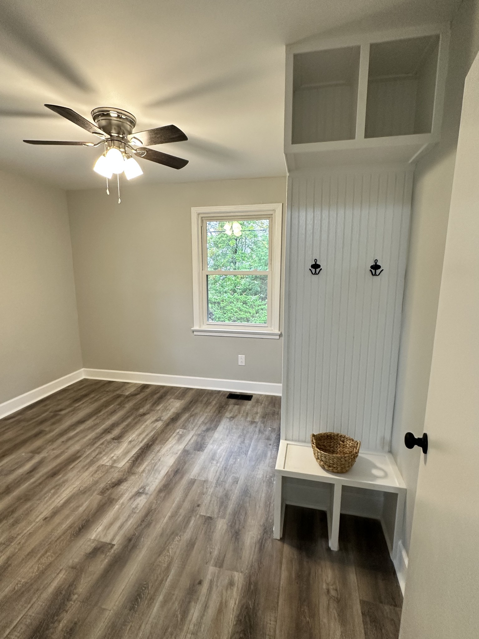 205 Excell Road Clarksville, TN 37043 - Photo 17 of 33 a view of a room with wooden floor fan and windows