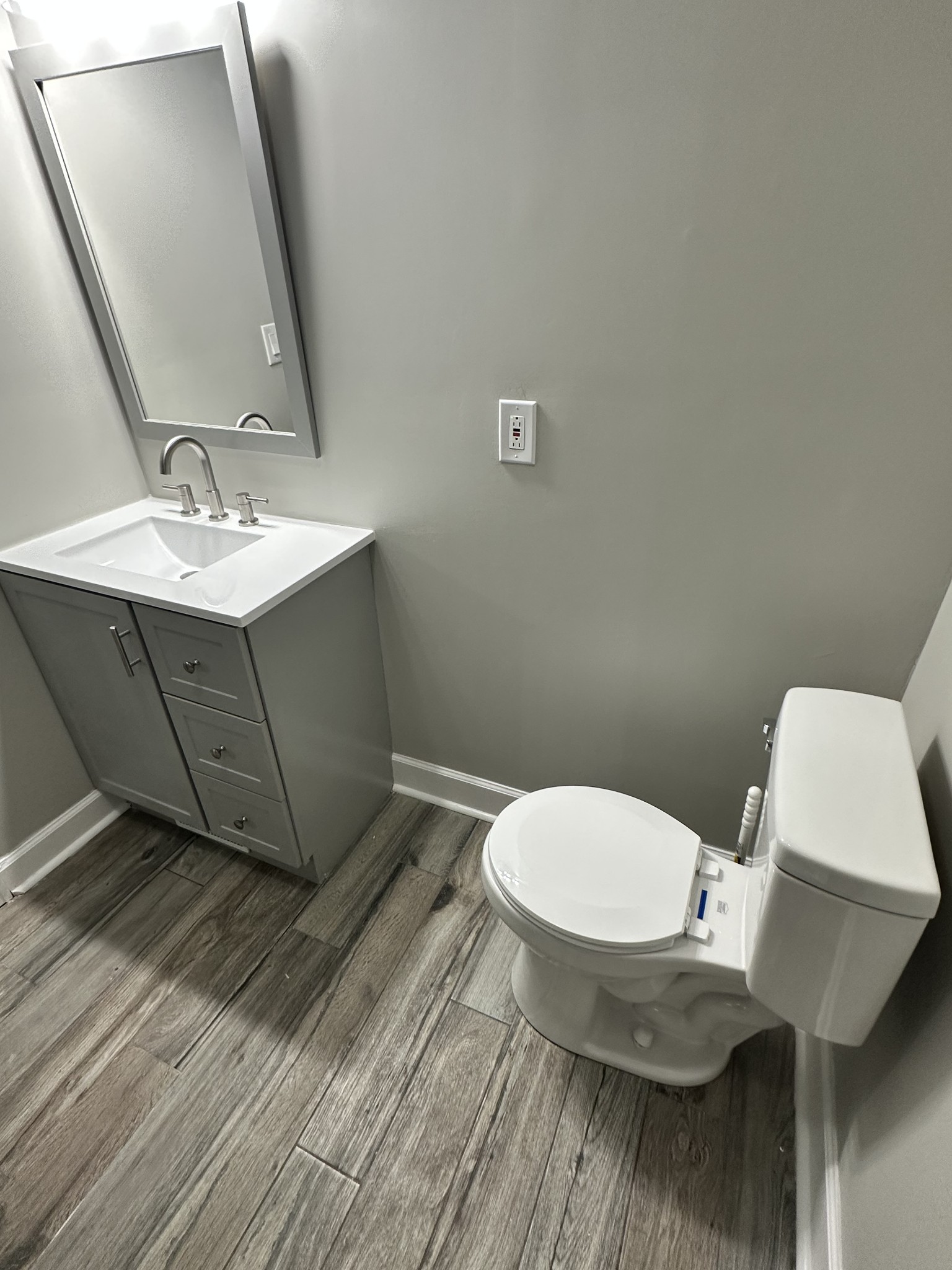 205 Excell Road Clarksville, TN 37043 - Photo 22 of 33 a bathroom with a toilet sink and mirror