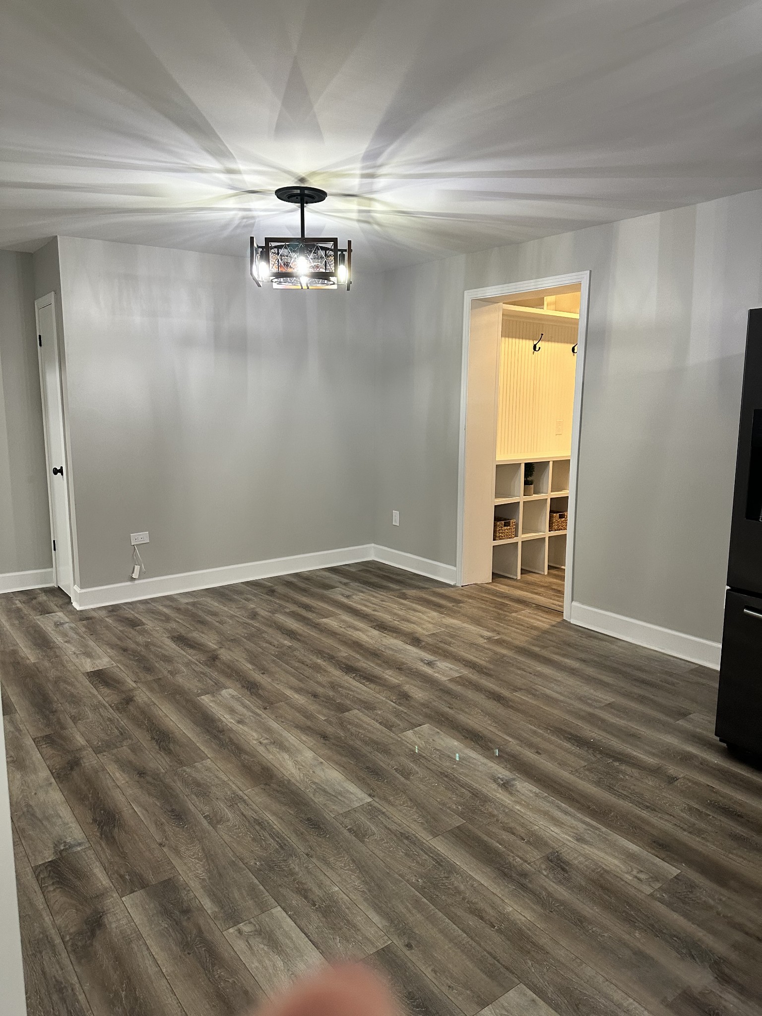 205 Excell Road Clarksville, TN 37043 - Photo 28 of 33 an empty room with wooden floor cabinet and windows