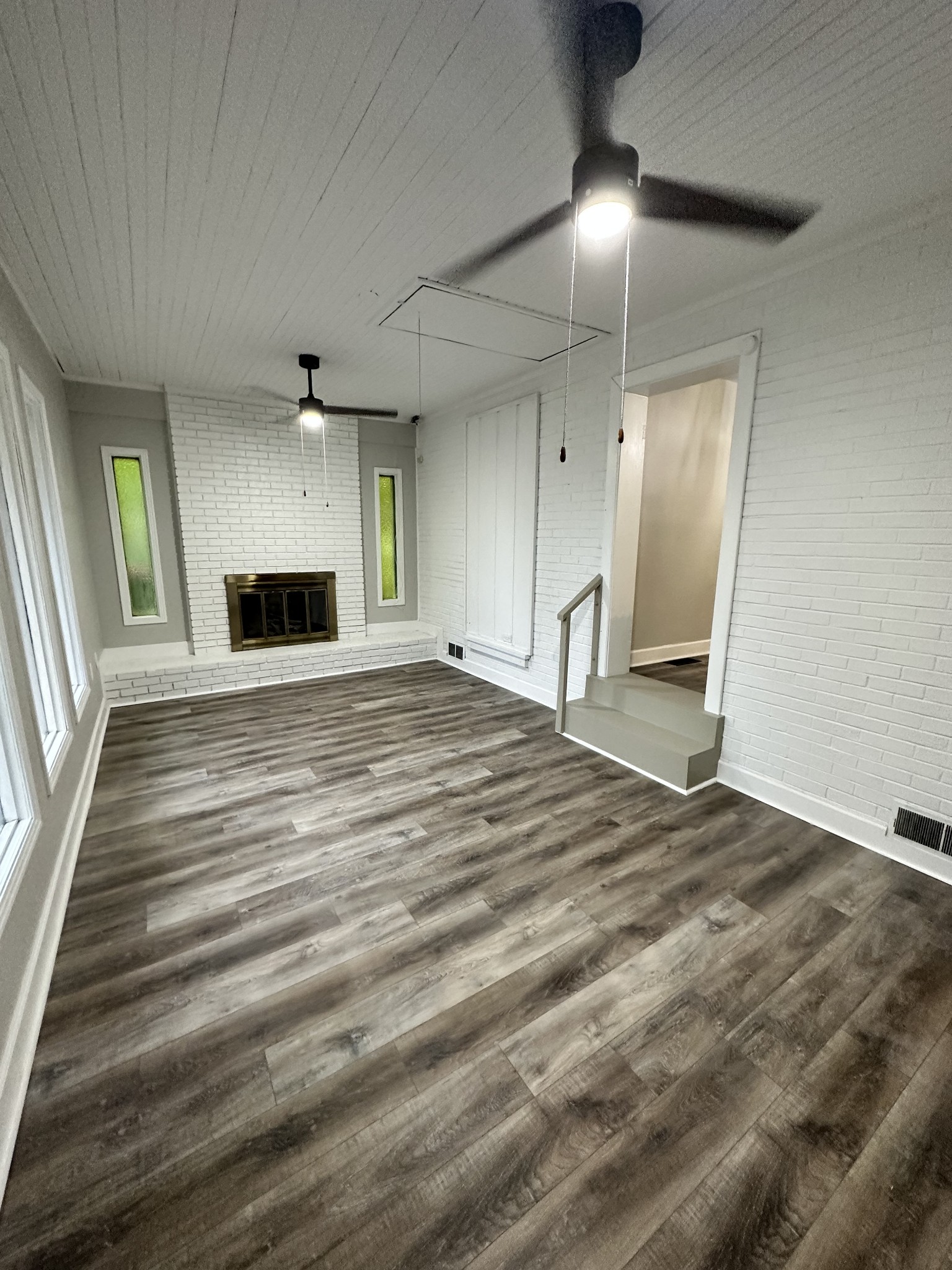 205 Excell Road Clarksville, TN 37043 - Photo 31 of 33 a view of an empty room with window and wooden floor