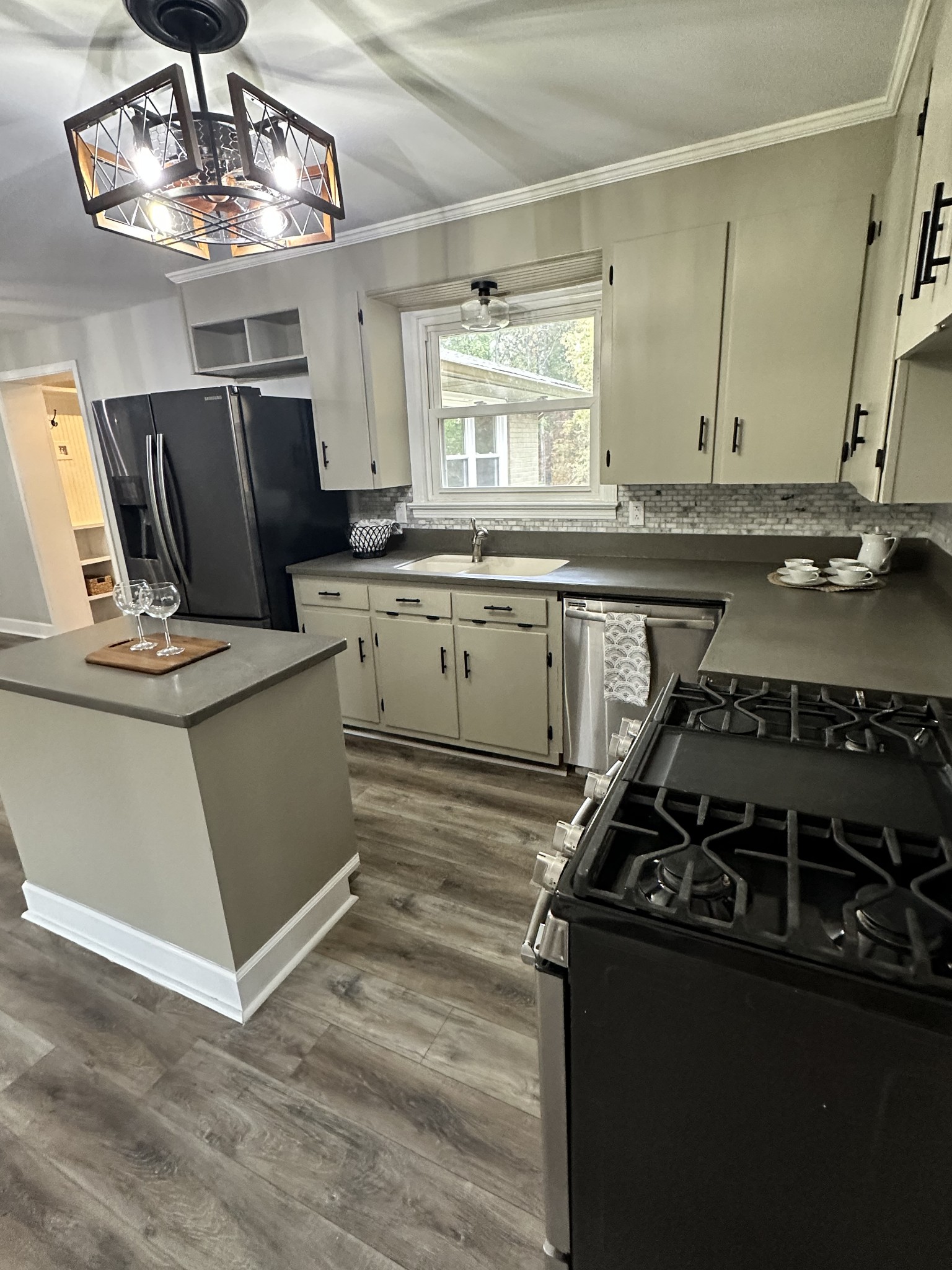 205 Excell Road Clarksville, TN 37043 - Photo 10 of 33 a kitchen with a stove and a refrigerator