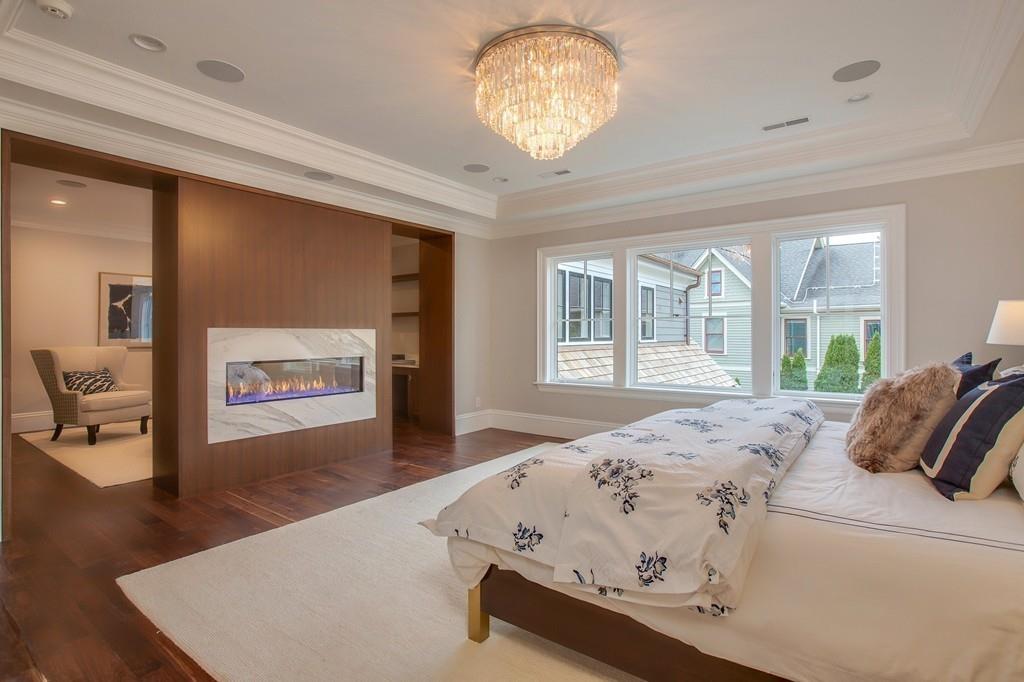 32 Forest Street Lexington, MA 02421 - Photo 12 of 23 a bed sitting in a spacious bedroom next to a window