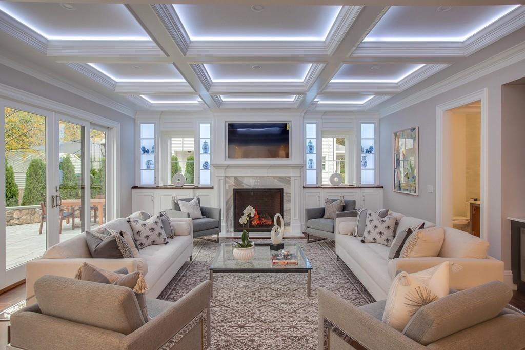 32 Forest Street Lexington, MA 02421 - Photo 6 of 23 a living room with furniture a flat screen tv and a fireplace