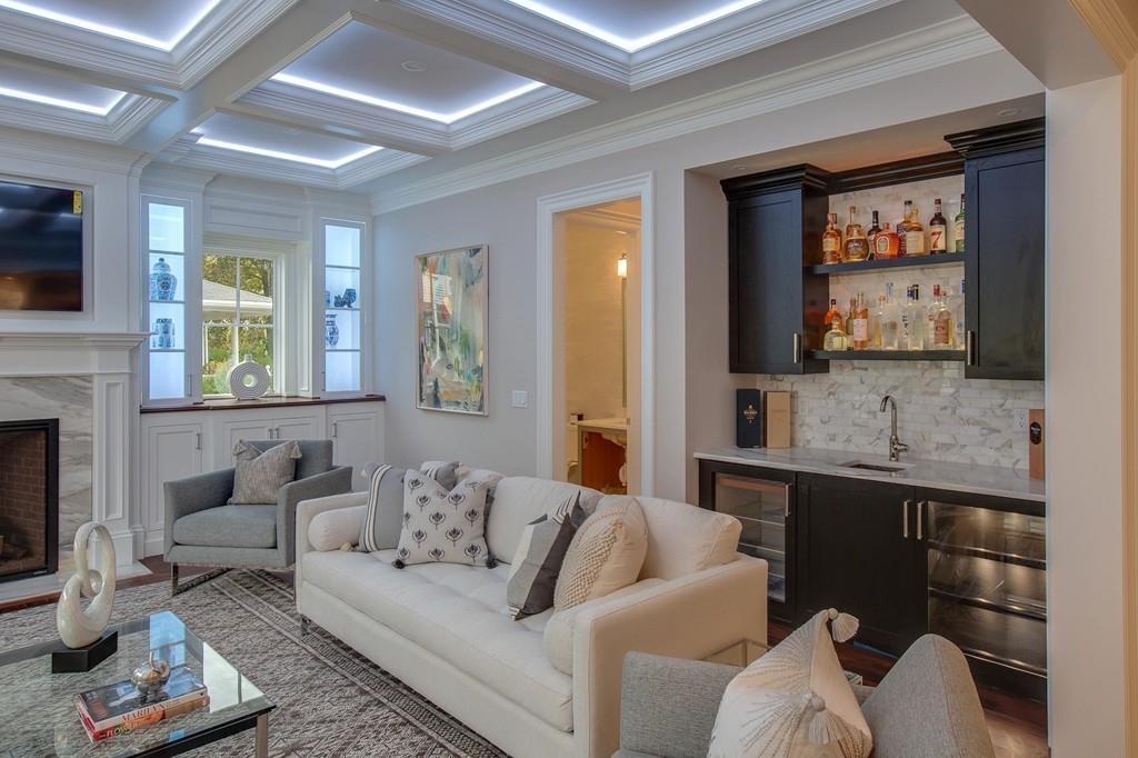 32 Forest Street Lexington, MA 02421 - Photo 7 of 23 a living room with furniture and a flat screen tv