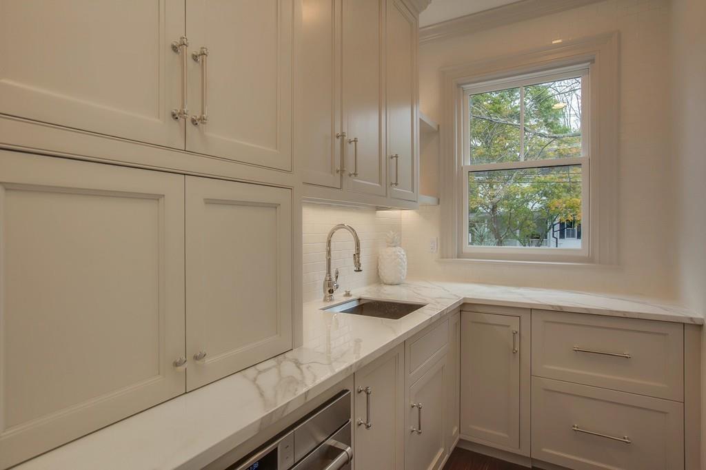 32 Forest Street Lexington, MA 02421 - Photo 10 of 23 a kitchen with a sink and cabinets