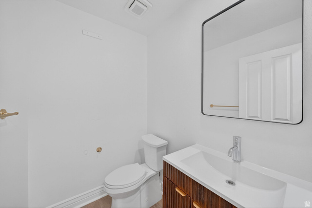 883 East 700 South Springville, UT 84663 - Photo 32 of 59 Powder room featuring a modern vanity with wood-finish cabinetry, a rectangular basin, and a contemporary mirror with a black frame
