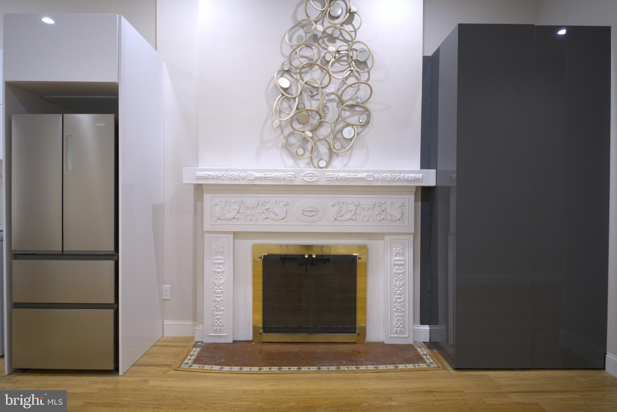 333 South 21st Street, Unit 1F Philadelphia, PA 19103 - Photo 4 of 15 a view of a livingroom with a fireplace