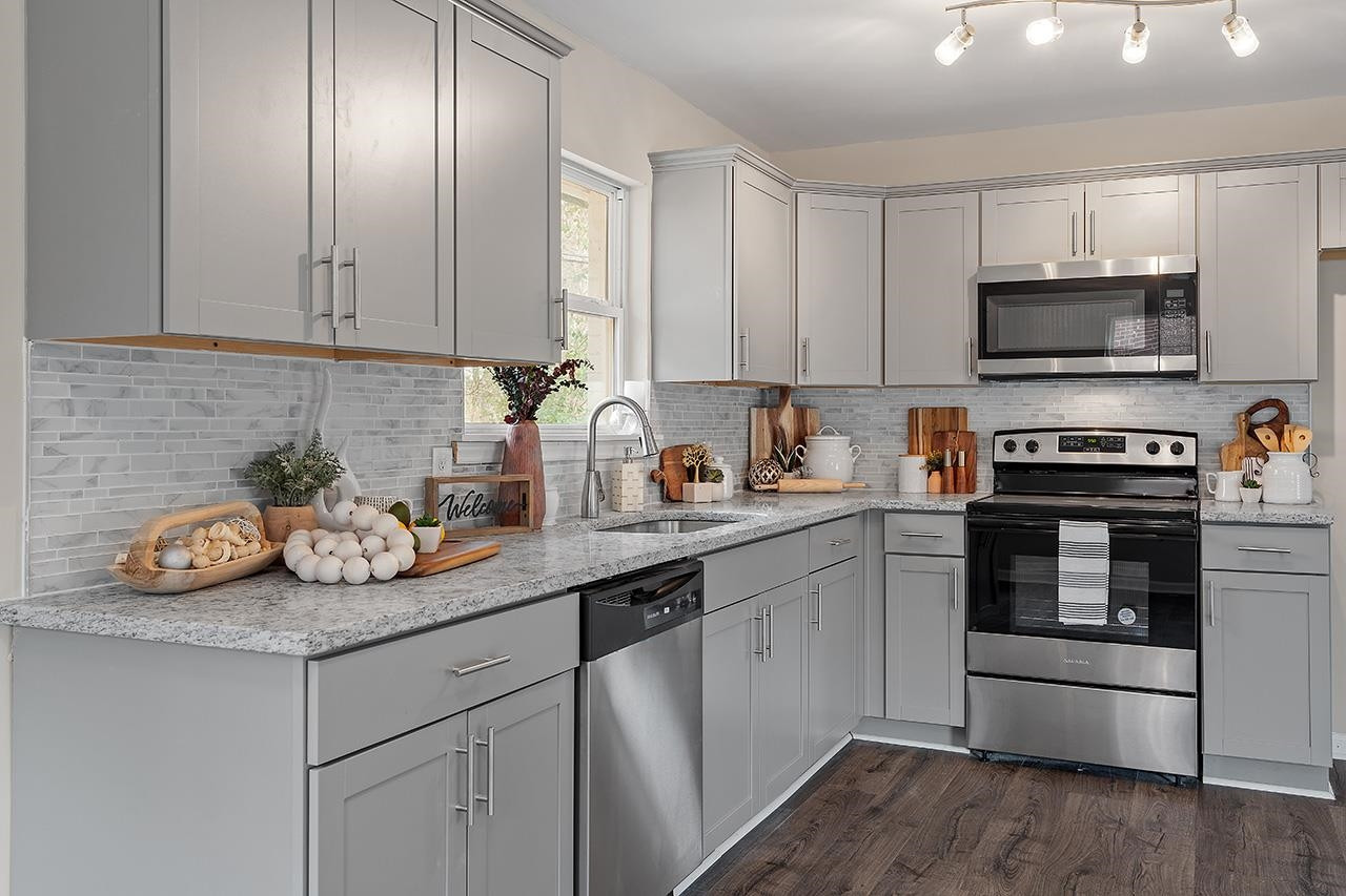 1101 Springdale Drive Durham, NC 27707 - Photo 11 of 24 a kitchen with appliances a sink and cabinets