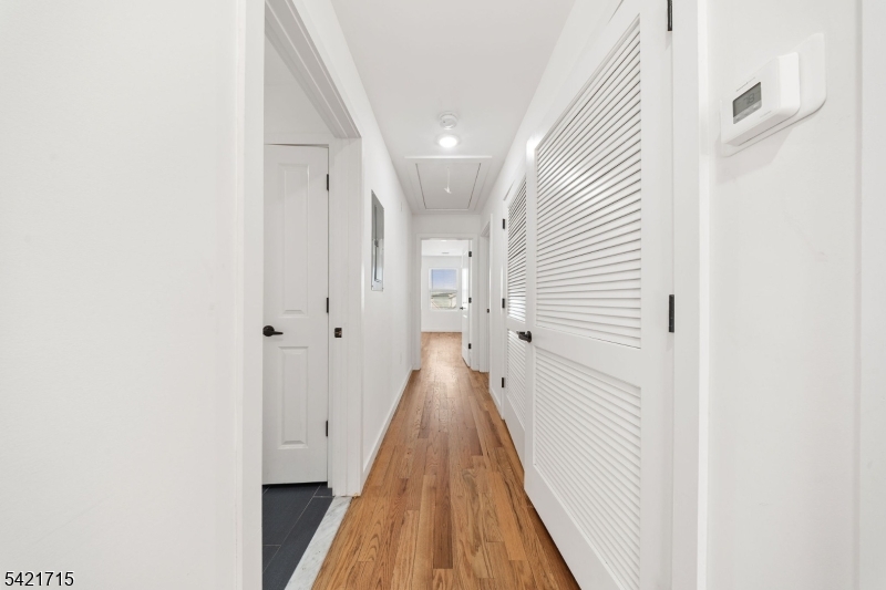 735 Seaport Drive, Unit 2 Elizabeth, NJ 07201 - Photo 16 of 28 a view of a hallway with wooden floor
