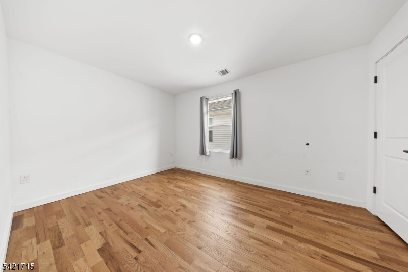 735 Seaport Drive, Unit 2 Elizabeth, NJ 07201 - Photo 18 of 28 a view of empty room with wooden floor