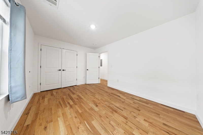 735 Seaport Drive, Unit 2 Elizabeth, NJ 07201 - Photo 19 of 28 a view of empty room with wooden floor