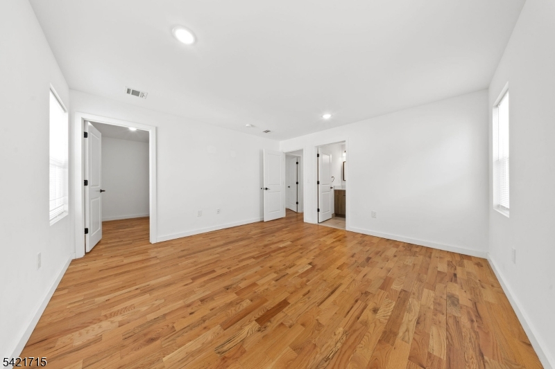 735 Seaport Drive, Unit 2 Elizabeth, NJ 07201 - Photo 21 of 28 a view of empty room with wooden floor