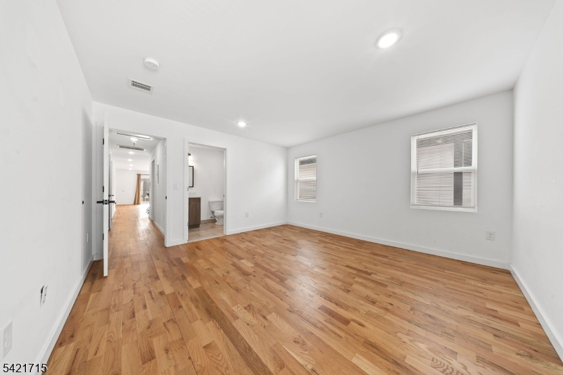 735 Seaport Drive, Unit 2 Elizabeth, NJ 07201 - Photo 22 of 28 a view of empty room with wooden floor