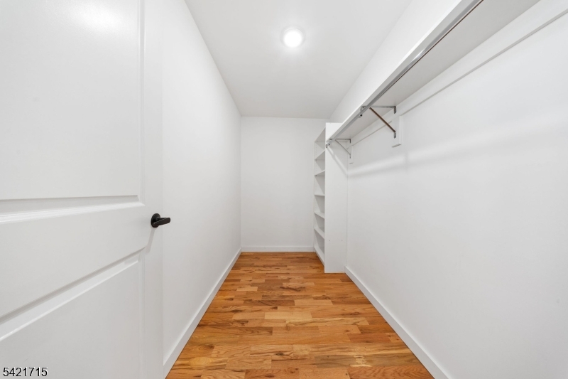 735 Seaport Drive, Unit 2 Elizabeth, NJ 07201 - Photo 23 of 28 a view of a hallway with wooden floor