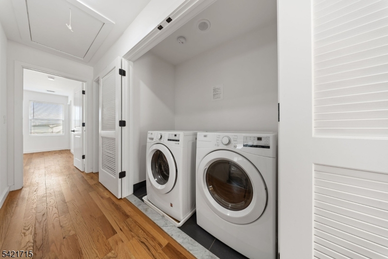 735 Seaport Drive, Unit 2 Elizabeth, NJ 07201 - Photo 24 of 28 a view of a hallway with washer and dryer