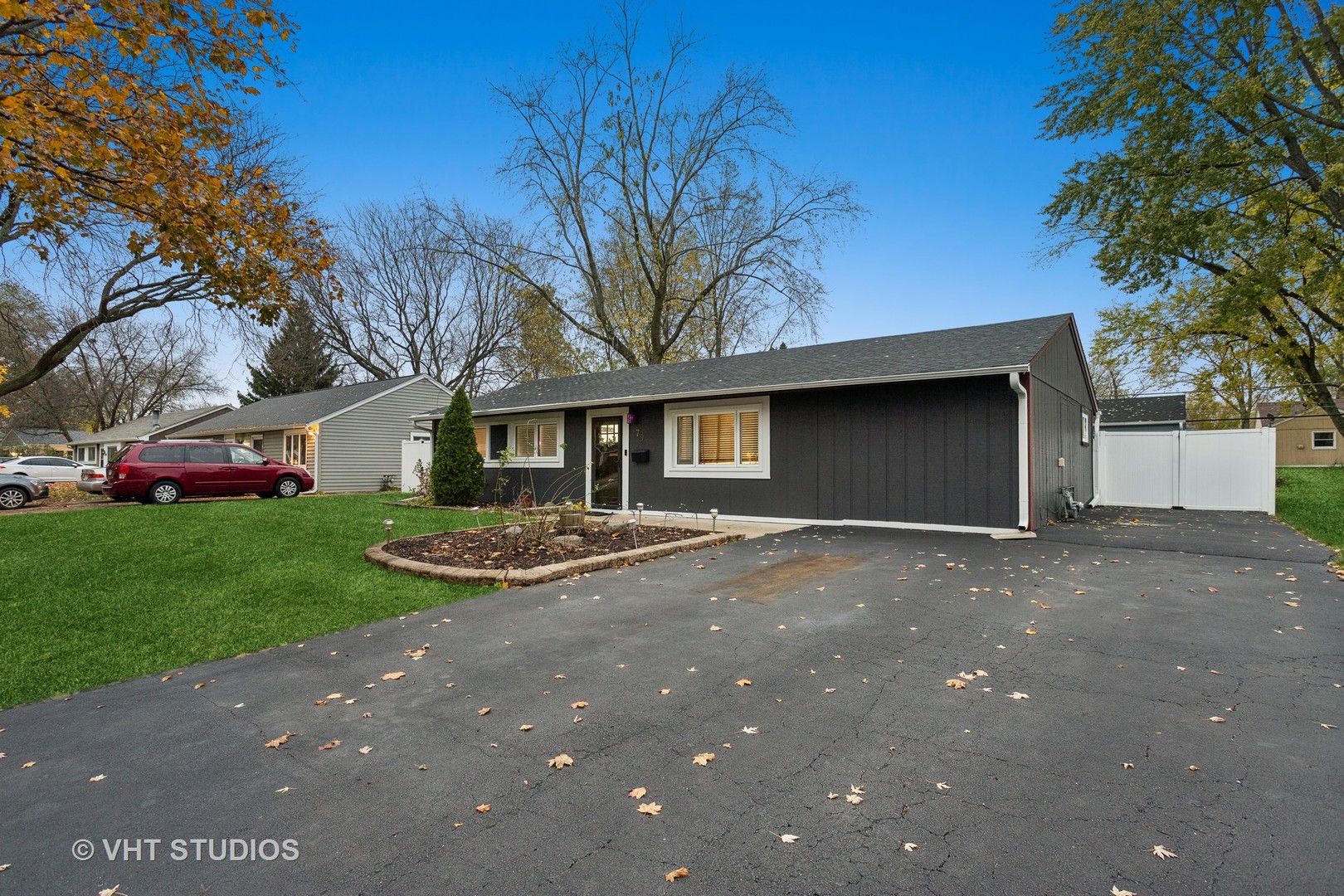 79 Sheffield Road Montgomery, IL 60538 - Photo 3 of 20 a front view of a house with a yard and garage