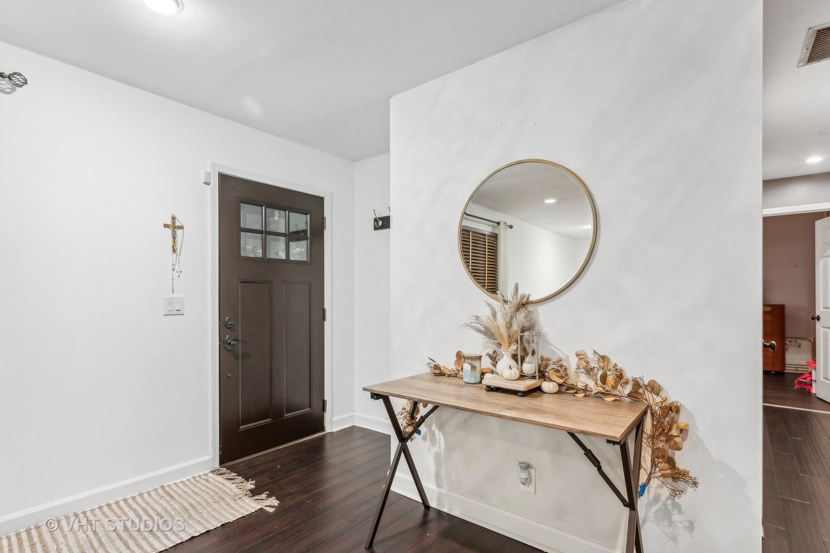 79 Sheffield Road Montgomery, IL 60538 - Photo 4 of 20 a view of a room that has a mirror and a table in it