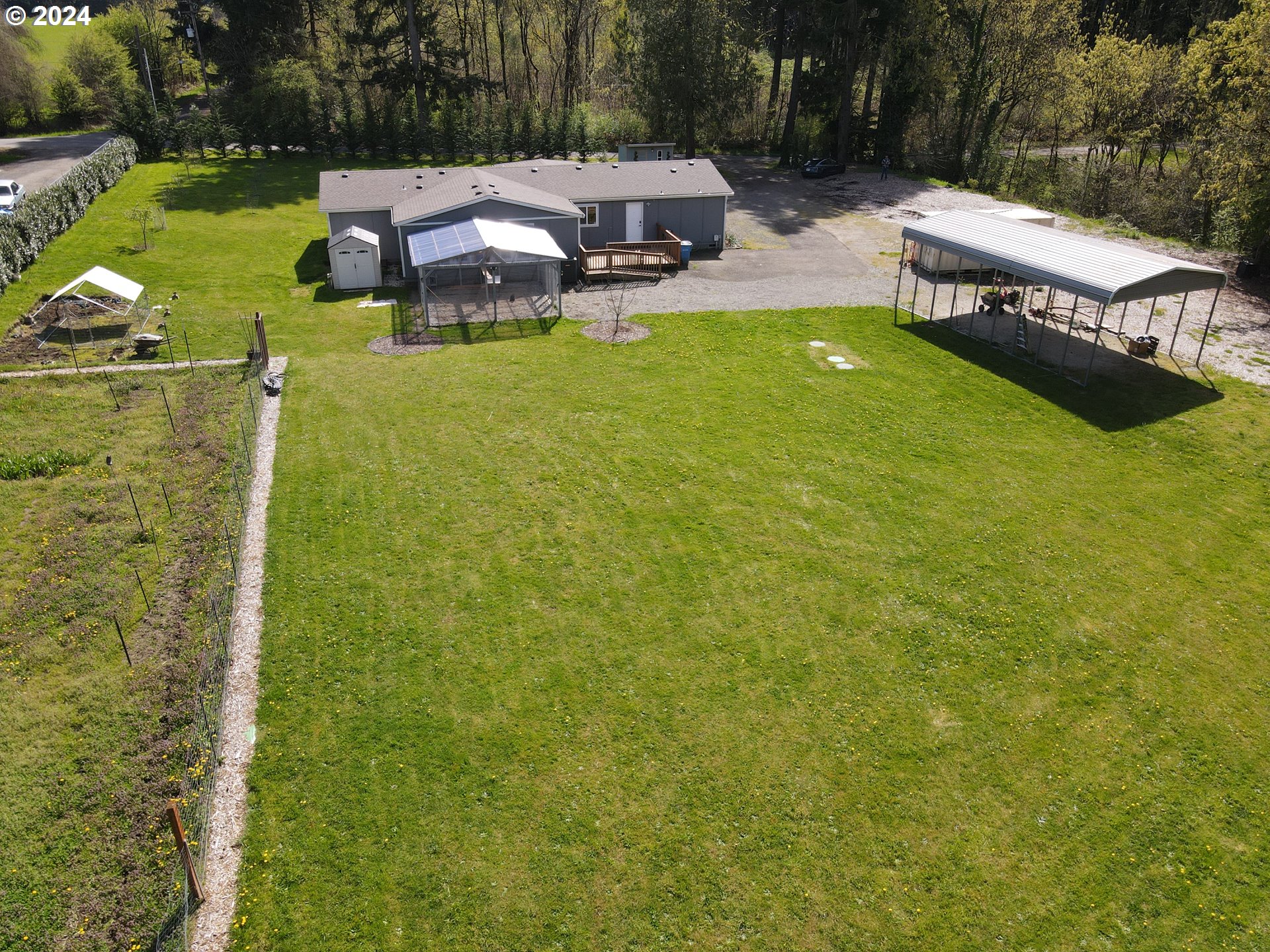 2112 Northwest 189th Street Ridgefield, WA 98642 - Photo 36 of 39 a backyard of a house with table and chairs