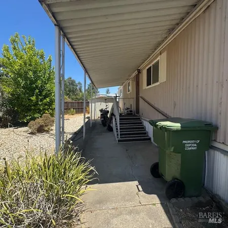 a view of a backyard with sitting area