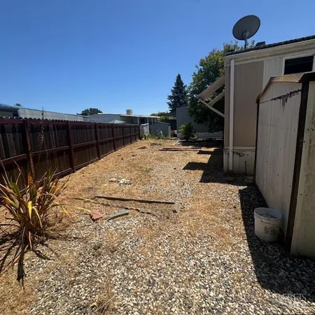 a view of a backyard of the house