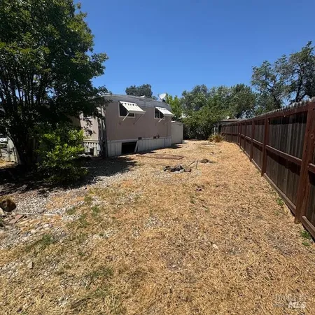 a view of swimming pool with a yard