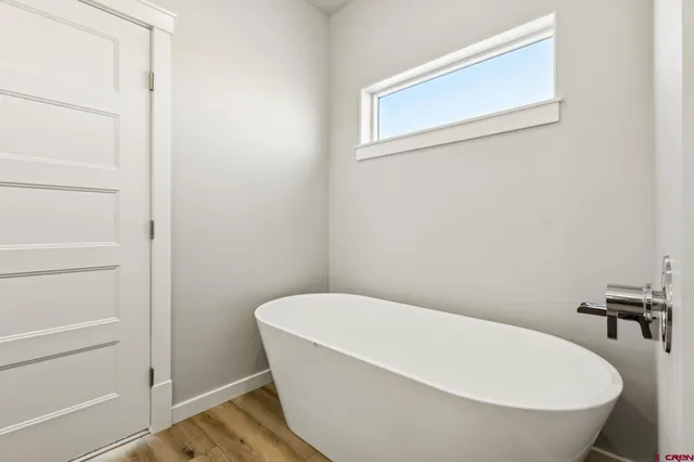 a white bath tub sitting in a bathroom