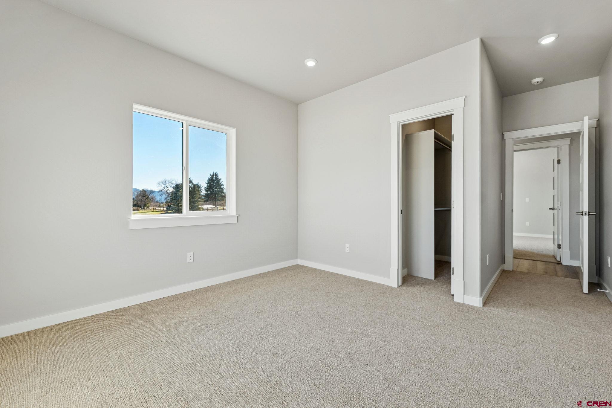 2223 Golf Course Lane Cortez, CO 81321 - Photo 12 of 26 an empty room with windows