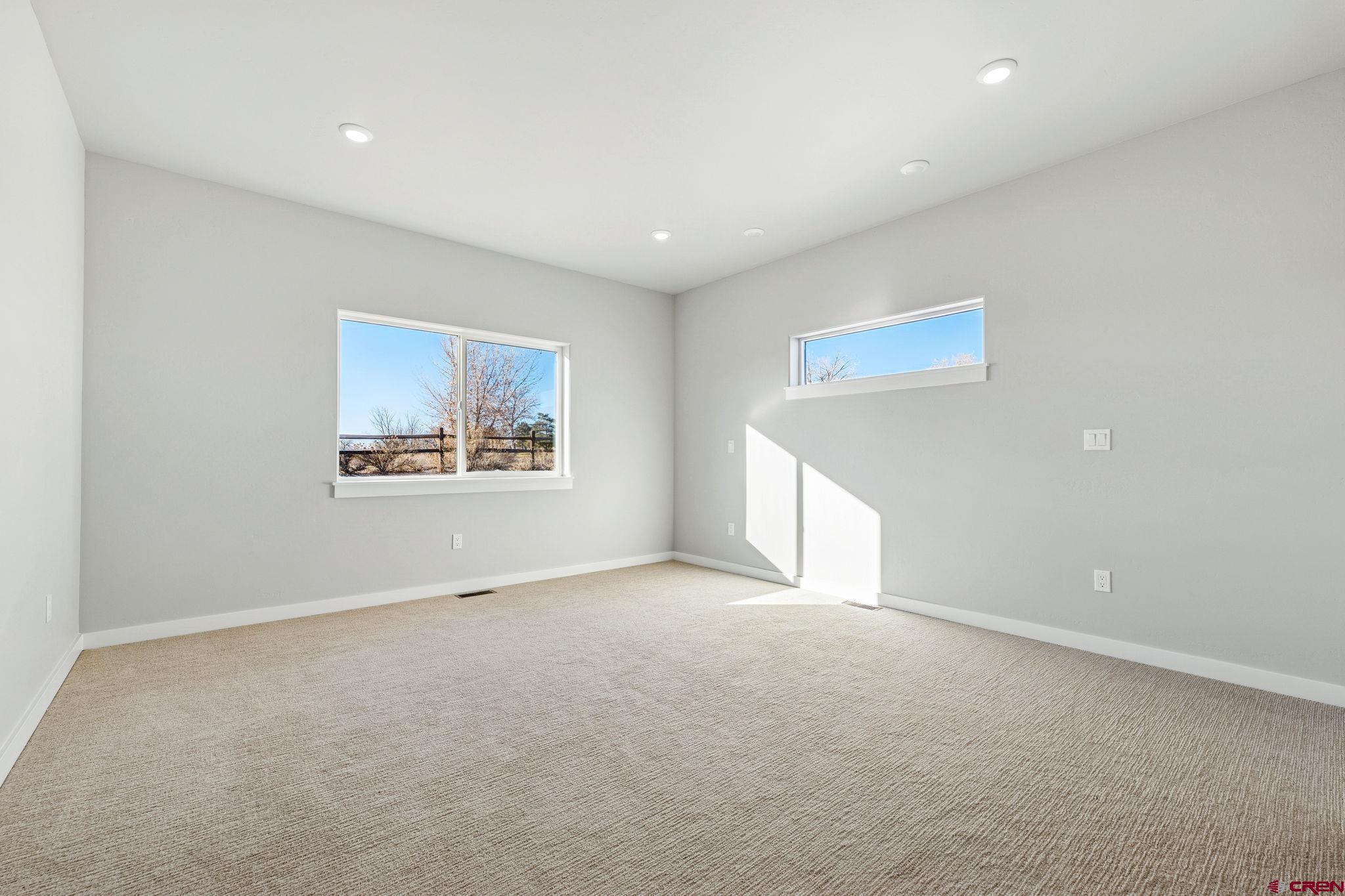 2223 Golf Course Lane Cortez, CO 81321 - Photo 13 of 26 a view of an empty room with a window