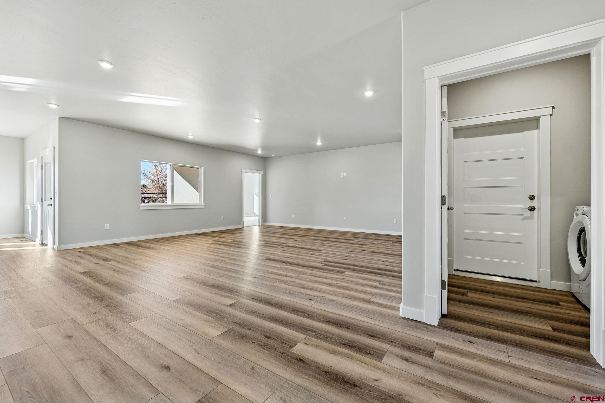2223 Golf Course Lane Cortez, CO 81321 - Photo 18 of 26 a view of a livingroom with wooden floor and window