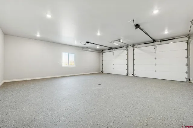 a view of a room with window and ceiling fan