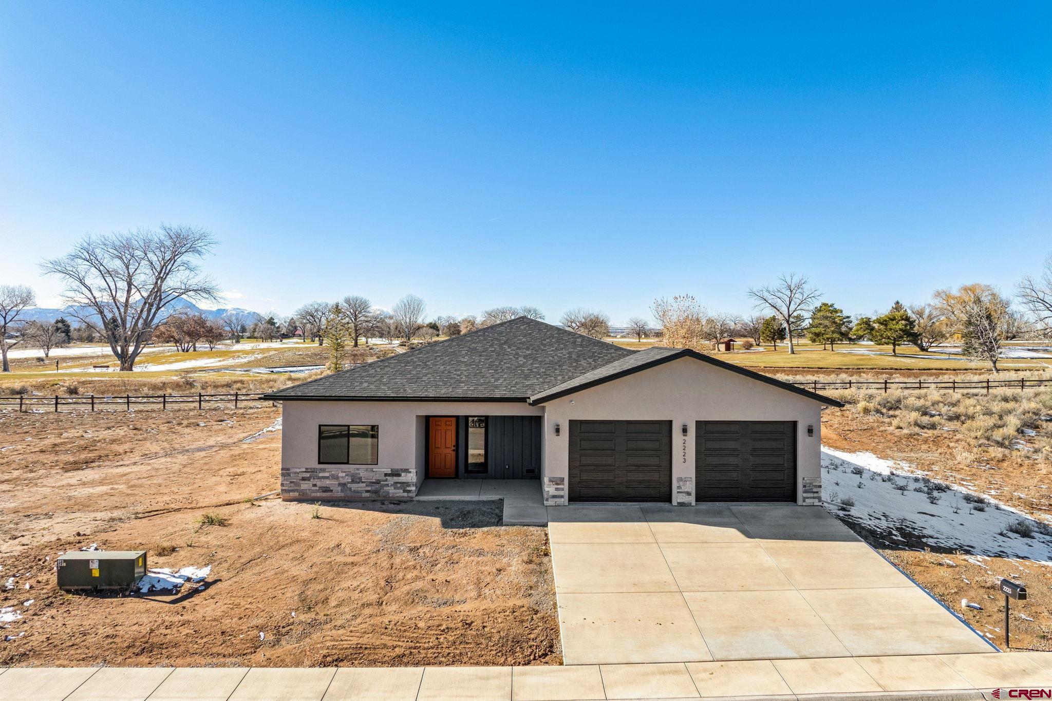 2223 Golf Course Lane Cortez, CO 81321 - Photo 21 of 26 a front view of a house with a yard