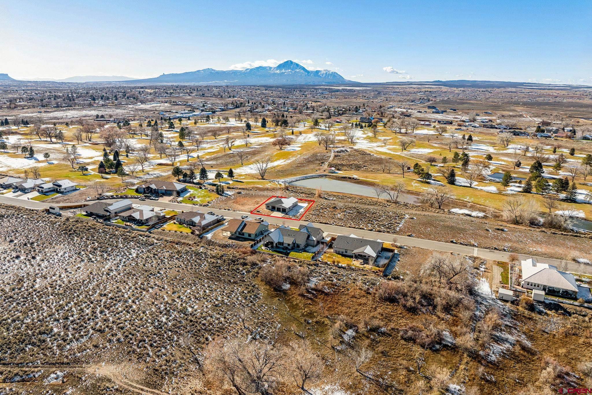 2223 Golf Course Lane Cortez, CO 81321 - Photo 24 of 26 an aerial view of residential building and car parked