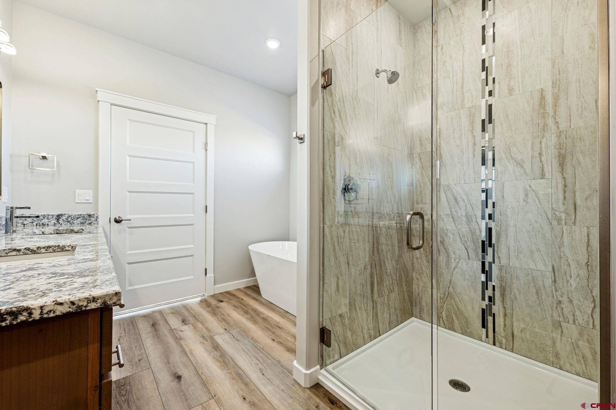 2223 Golf Course Lane Cortez, CO 81321 - Photo 9 of 26 a bathroom with a shower and a sink