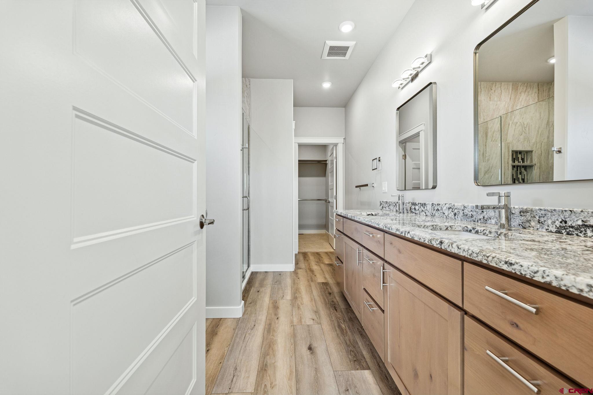 2223 Golf Course Lane Cortez, CO 81321 - Photo 10 of 26 a bathroom with a sink and a mirror