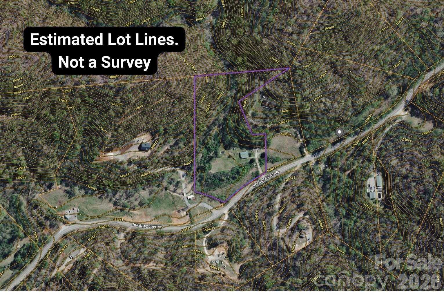 5712 Holbert Cove Road Saluda, NC 28773 - Photo 16 of 17 a view of a street with a bench under an umbrella