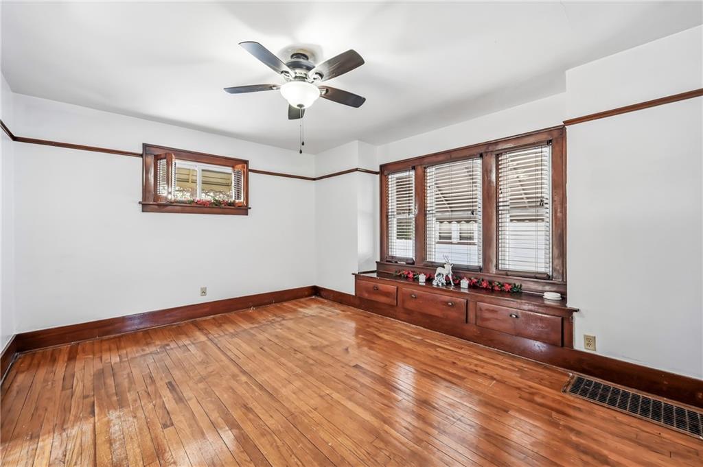 486 Tamplin Street Sharon, PA 16146 - Photo 16 of 37 a view of a room with wooden floor and fan