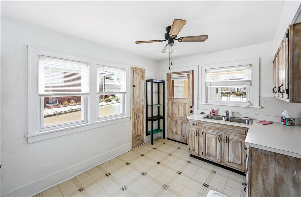 486 Tamplin Street Sharon, PA 16146 - Photo 18 of 37 a kitchen with stainless steel appliances a sink stove and refrigerator