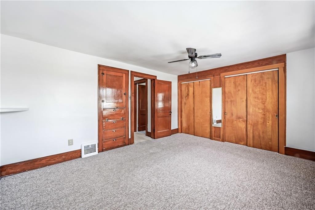 486 Tamplin Street Sharon, PA 16146 - Photo 20 of 37 a view of an empty room with a ceiling fan