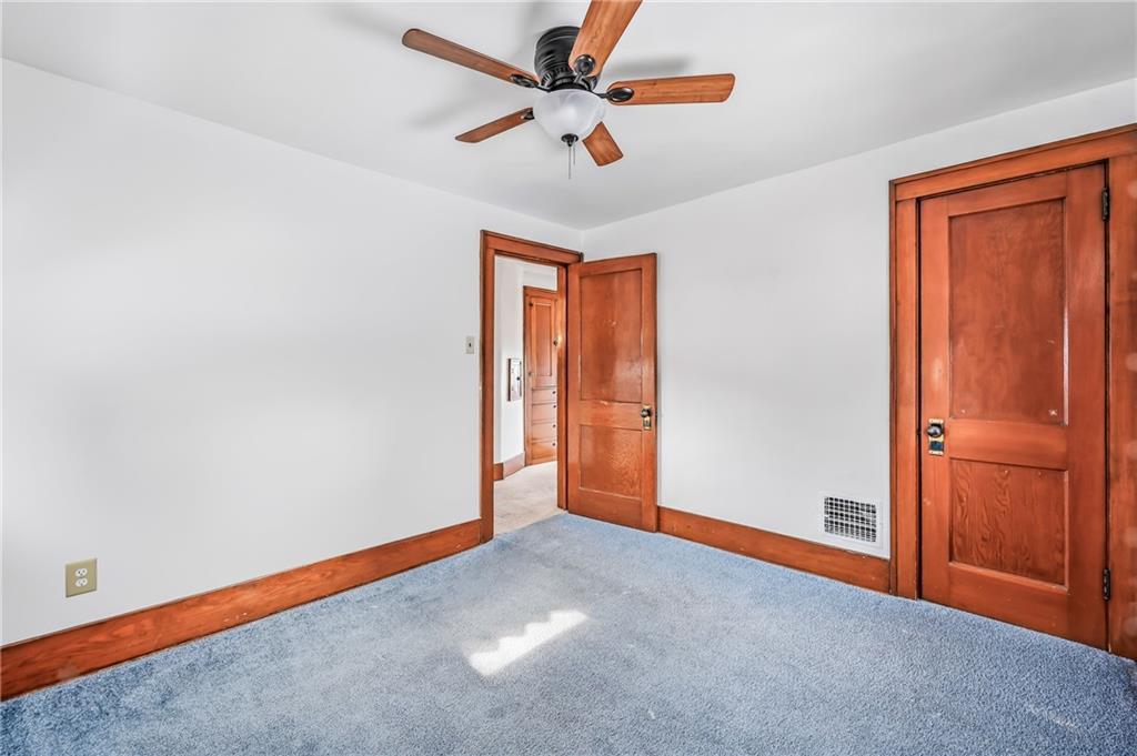 486 Tamplin Street Sharon, PA 16146 - Photo 22 of 37 an empty room with closet and fan