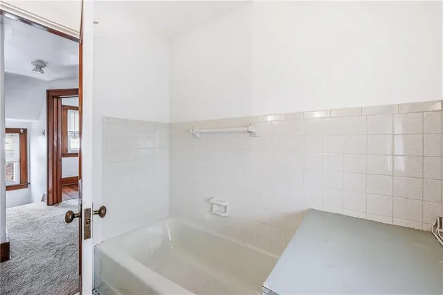 a view of empty room with ceiling fan