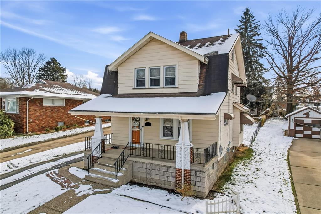 486 Tamplin Street Sharon, PA 16146 - Photo 3 of 37 a view of a white house with large windows and a table and chairs