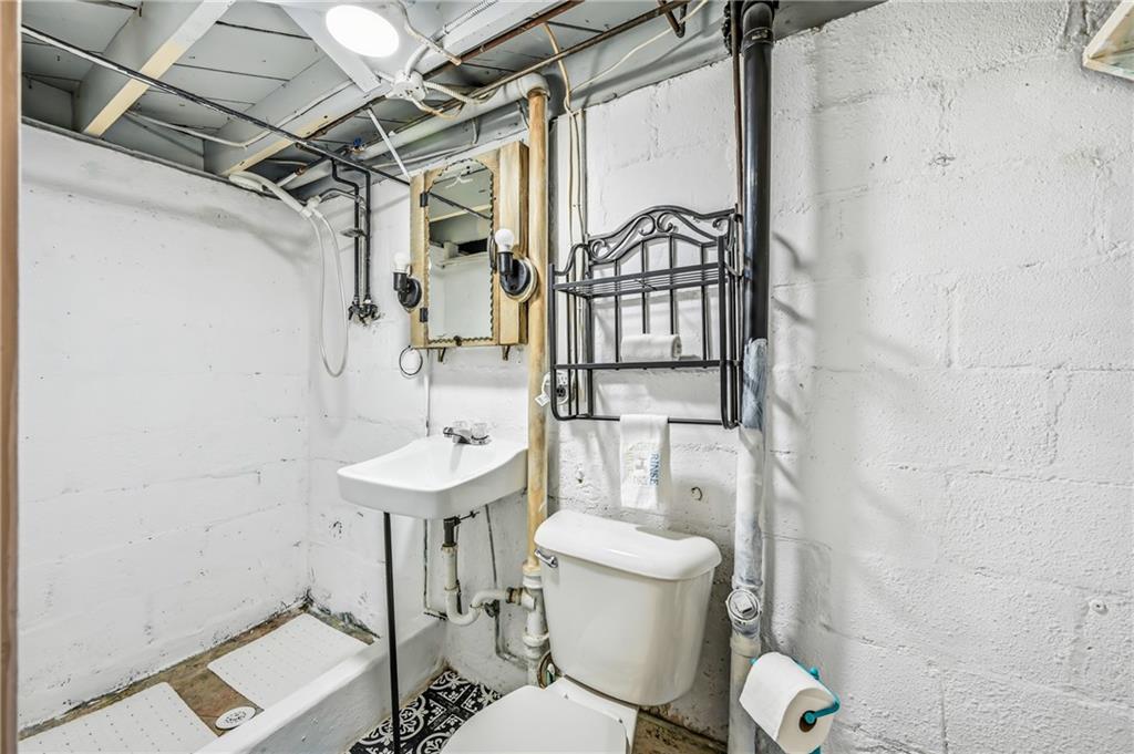 486 Tamplin Street Sharon, PA 16146 - Photo 36 of 37 a bathroom with a sink a toilet and shower